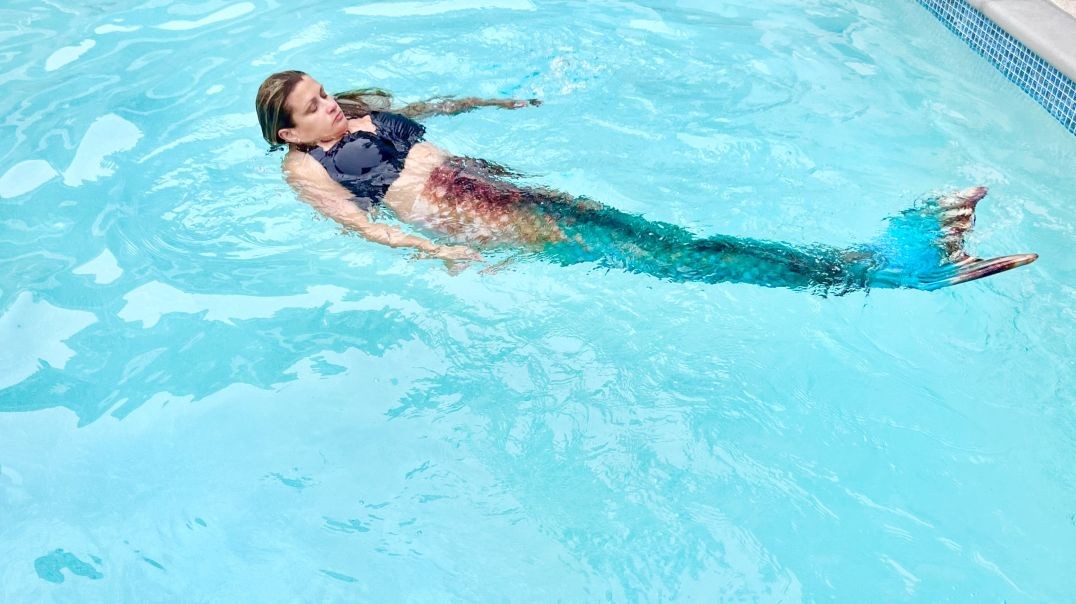 Dasha the mermaid swimming